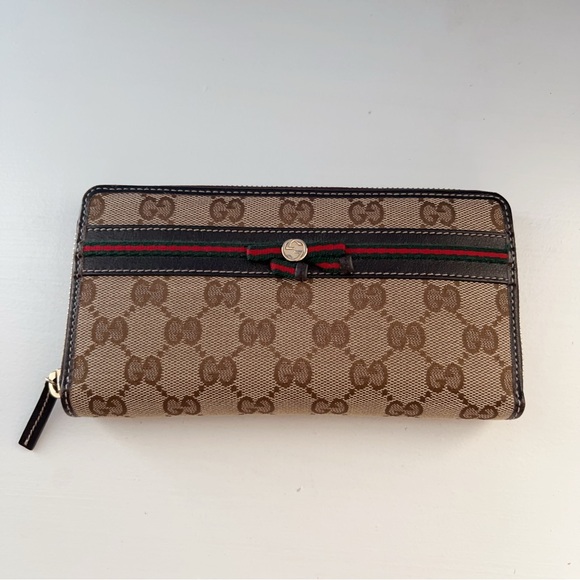 Gucci Handbags - Like new Authentic Gucci Zip Around Long Wallet GG Supreme Canvas